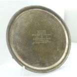 ELKINGTON & CO. AN EARLY 20TH SILVER SALVER, gadrooned rim, raised on three feet, bears presentation