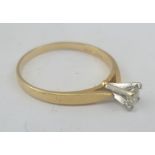 A 14k GOLD SOLITAIRE DIAMOND RING