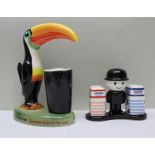 A PAINTED POTTERY FIGURE OF THE GUINNESS TOUCAN bearing the words 'How grand to be