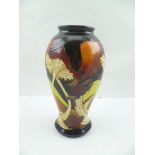 AN EARLY 21ST CENTURY MOORCROFT POTTERY VASE, of baluster form, tube lined and glazed in the "