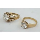 TWO 9CT GOLD DRESS RINGS, each set with a solitaire cubic zirconia