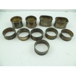 ROBERT PRINGLE & SONS A SET OF SIX EDWARDIAN SILVER NAPKIN RINGS, having chased panels, each