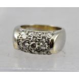 AN 18CT WHITE GOLD RING set with five rows of diamonds (17 stones), size K