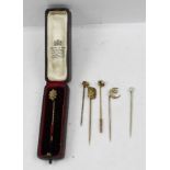 A VICTORIAN STONE SET 15CT GOLD GENTLEMAN'S STICK PIN, together with two 9ct gold STICK PINS,