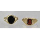 A 9CT GOLD ONYX RING, size L, together with a 9CT GOLD GARNET RING, size M 1/2