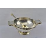 WILLIAM DAVENPORT A CELTIC DESIGN SILVER PORRINGER, fitted with a pair of lug handles,