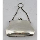 A LATE VICTORIAN WHITE METAL EVENING PURSE with green fabric interior, the chain handle with