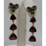 A PAIR OF TRIPLE GARNET AND DIAMOND BOW EARRINGS, drop 4.5cm long