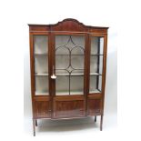 AN EDWARDIAN MAHOGANY FINISHED DISPLAY CABINET, having fancy inlaid glazed carcase, with single