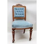 A LATE 19TH CENTURY OAK FRAMED SINGLE CHAIR in the aesthetic taste, having blue velvet button back