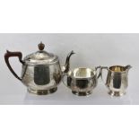 SELFRIDGE & CO LTD A 20TH CENTURY THREE-PIECE SILVER TEA SET, comprising tea pot with hinged