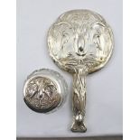 WILLIAM AITKEN AN ART NOUVEAU EMBOSSED SILVER HAND HELD VANITY MIRROR, the handle and surround