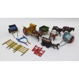 A COLLECTION OF BRITAINS AND OTHER DIE-CAST FARM CARTS including a spare set of shafts for a