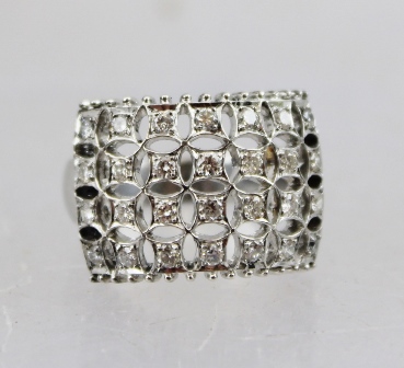 A WHITE GOLD LADY'S DRESS RING, with twenty-eight diamonds in a pierced setting, believed to be