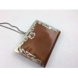 A SILVER MOUNTED LEATHER PURSE 1903, having possibly pig skin interior