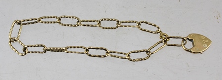 A 9CT GOLD BRACELET with large twist links, fitted padlock clasp, weight 7g