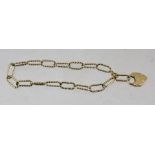 A 9CT GOLD BRACELET with large twist links, fitted padlock clasp, weight 7g