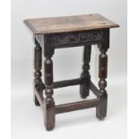 AN 18TH CENTURY OAK JOINT STOOL, of typical form and construction with later carved top and sides,