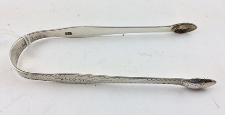 A PAIR OF 18TH CENTURY SILVER SUGAR TONGS by Hester Bateman