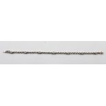 AN 18CT WHITE GOLD SLENDER BOX LINK BRACELET, set with seven diamonds, stamped .750