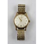 A 9CT GOLD CASED LONGINES GENTLEMAN'S WRISTWATCH, set 17-jewel movement, on a plated expandable