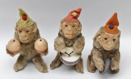 THREE PLUSH COVERED CLOCKWORK MONKEY BAND PLAYERS playing cymbals, drum and maracas