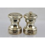 TIFFANY A PAIR OF SILVER CONDIMENTS of waisted form, the pepper being an operative grinder,