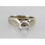 A WHITE GOLD SOLITAIRE CUBIC ZIRCONIA LADY'S RING, stamped 10k, ring size N and half