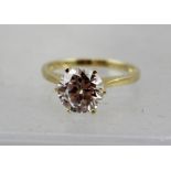 A 14CT GOLD LADY'S CUBIC ZIRCONIA SOLITAIRE RING in claw setting, ring size J and half