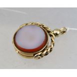 A VICTORIAN 18CT GOLD DOUBLE STONE SET SWIVEL FOB opening to reveal a locket, indistinctly marked,