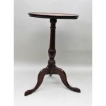 A 19TH CENTURY OAK SAUCER TOP WINE TABLE, on baluster turned column and three swept legs, 68cm