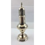 A GEORGE III SILVER SUGAR CASTER of knopped pedestal design, having lozenge decorated cover with