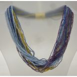 A MURANO MULTI-STRAND GLASS BEAD NECKLACE, with blue, gold and purple colours, (this necklace can be