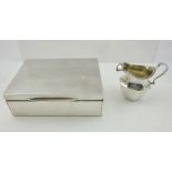 HUKIN & HEATH A SILVER CIGARETTE BOX, having cedar lined interior, the cover engraved with