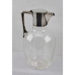 A SILVER PLATED CLARET JUG, hinged cover with integral handle (marked with a sun and MB, for