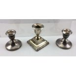 S. BLANCKENSEE & SON LTD. A SQUARE BASED SILVER CANDLESTICK, with bound reed decoration, Chester