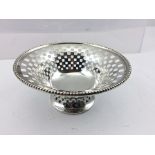 E.J. HOULSTON A PIERCED SILVER BONBON BOWL, having beaded rim, Birmingham 1910, 10cm diameter, 52g.