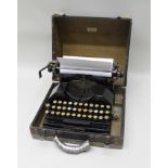 AN ORIGINAL "MOLLE" BRANDED MANUAL TYPEWRITER, in remains of original carrying case