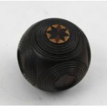 A VICTORIAN TURNED ROSEWOOD PUZZLE BALL with marquetry decoration to one roundel, 4.5cm diameter