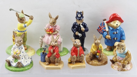 A COLLECTION OF ROYAL DOULTON CERAMIC FIGURES "The Bunnykins" Series comprising; "Sitting on