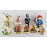 A COLLECTION OF ROYAL DOULTON CERAMIC FIGURES "The Bunnykins" Series comprising; "Sitting on
