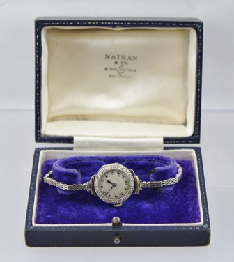 A LADY'S EVENING WATCH, 18ct white gold case with silvered dial, bearing Arabic numerals, the