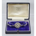 A LADY'S EVENING WATCH, 18ct white gold case with silvered dial, bearing Arabic numerals, the