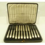 COOPER BROTHERS AND SONS LTD. A CASED SET OF SILVER HANDLED DESSERT KNIVES AND FORKS for six,