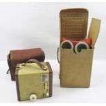 A WORLD WAR II CHILD'S GAS MASK, rubber with blue straps, in original card box of issue, together