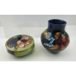 A MID 20TH CENTURY MOORCROFT POTTERY VASE of squat baluster form, mottled blue ground, tube lined