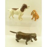 A ROYAL DOULTON CERAMIC MODEL OF A CHOCOLATE COLOURED LABRADOR, together with a BESWICK MODEL OF A