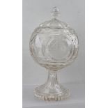 A 19TH CENTURY CUT GLASS STEMMED BOWL with cover, having three engraved roundels to the body, to