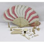 A QUANTITY OF 19TH CENTURY BONE ITEMS, includes a fan, cross pendant, and various toys