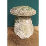 A 19TH CENTURY LIMESTONE STADDLE STONE with cap, 48cm diameter